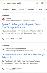 Screenshot of a Google search results page for 'google ads audit' showing two sponsored listings with contact phone numbers